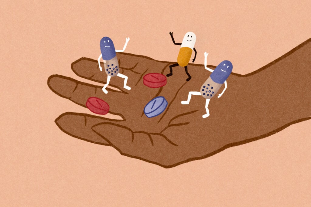 Cartoon pills dancing on hand